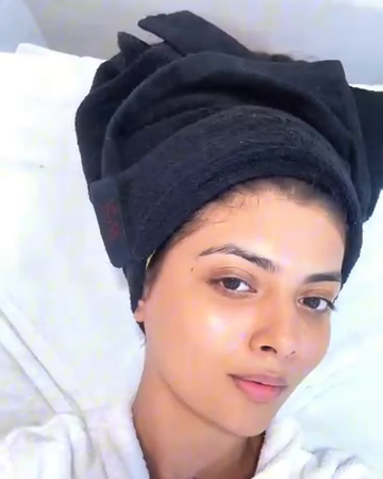 The finished skin at the end of the facial, hair wrapped in a towel.