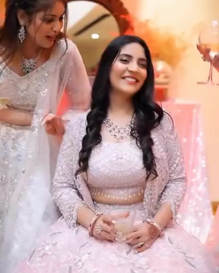 Five cocktail looks in pastel lehengas, one seated and laughing, the others around her.