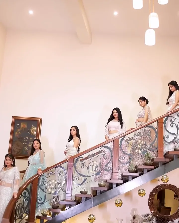 Six cocktail looks in pastel and ivory lehengas on a staircase, from our styled shoot.