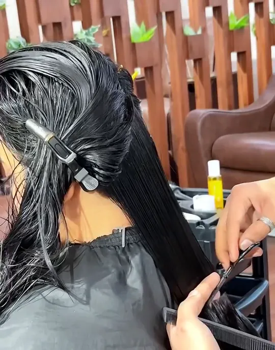 A women's haircut shot as before and after.